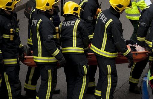 Members of the emergency services evacuate a mock casualty during a security drill in preparation for the 2012 Olympics