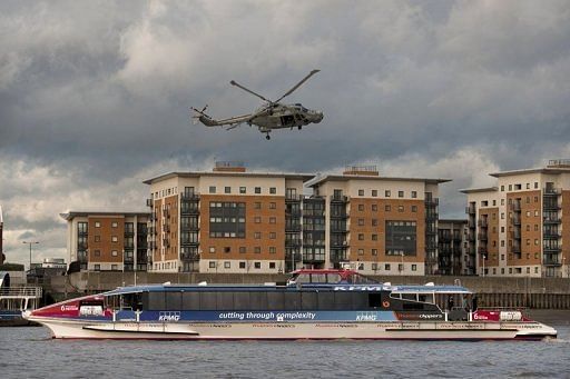 A helicopter over the Thames during a safety and security planning exercise for the London Olympics in January