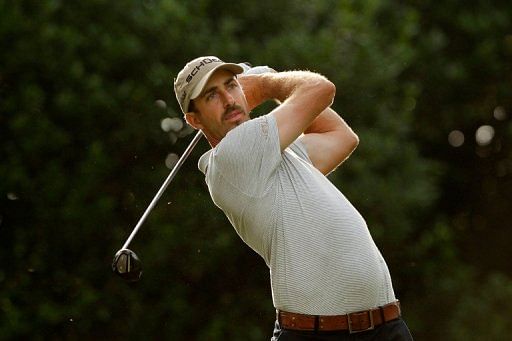 Geoff Ogilvy of Australia hits his tee shot on the 11th hole Geoff Ogilvy of Australia hits his tee shot on the 11th hole