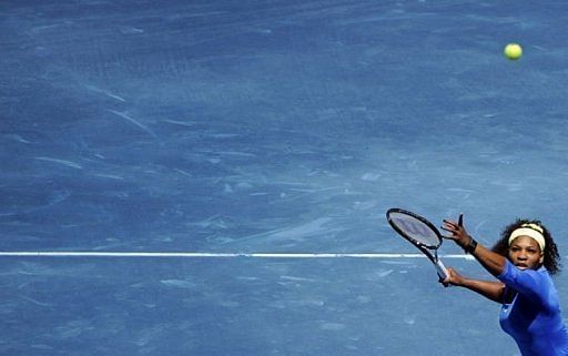 US Serena Williams returns a ball against Danish Caroline Wozniacki US Serena Williams returns a ball against Danish Caroline Wozniacki