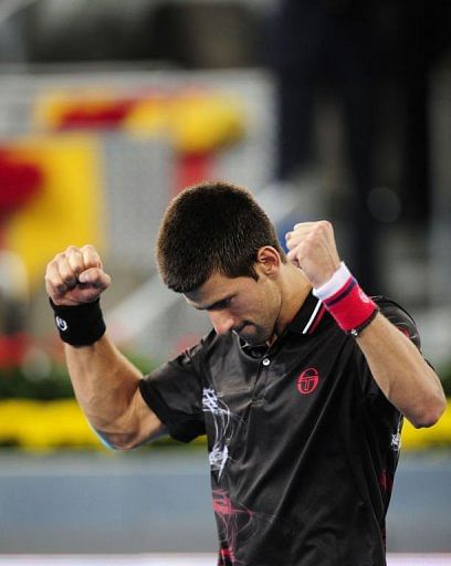 Serbian Novak Djokovic celebrates winning against Swiss Stanlislav Wawrinka Serbian Novak Djokovic celebrates winning against Swiss Stanlislav Wawrinka
