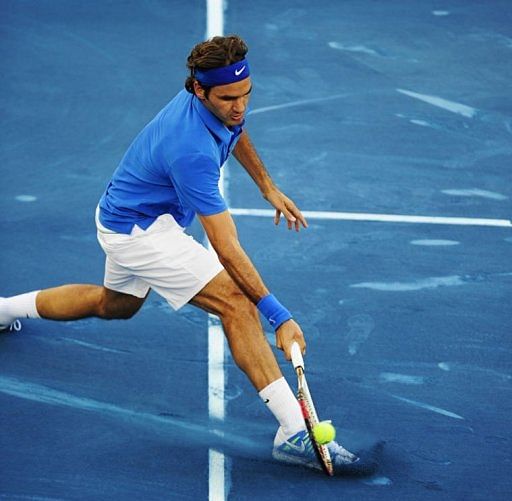 Swiss Roger Federer returns a ball to French Richard Gasquet Swiss Roger Federer returns a ball to French Richard Gasquet
