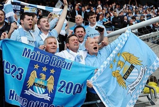 Manchester City's supporters celebrate after their team's 3-2 victory Manchester City's supporters celebrate after their team's 3-2 victory