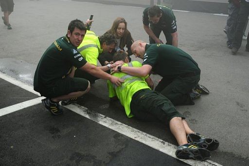 Crew members assist an injured colleague during the fire Crew members assist an injured colleague during the fire