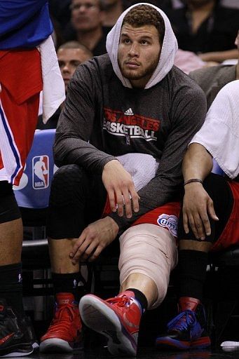 Blake Griffin of the Los Angeles Clippers sits on the bench with a wrapped knee Blake Griffin of the Los Angeles Clippers sits on the bench with a wrapped knee