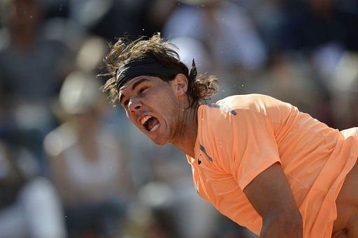 Spain's Rafael Nadal serves Spain's Rafael Nadal serves