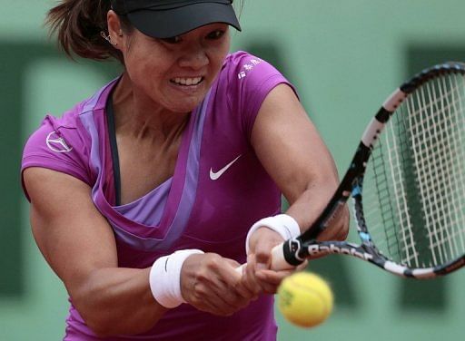 Defending champion Li Na has crashed out of the French Open Defending champion Li Na has crashed out of the French Open