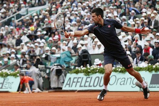 Novak Djokovic hits a return Novak Djokovic hits a return