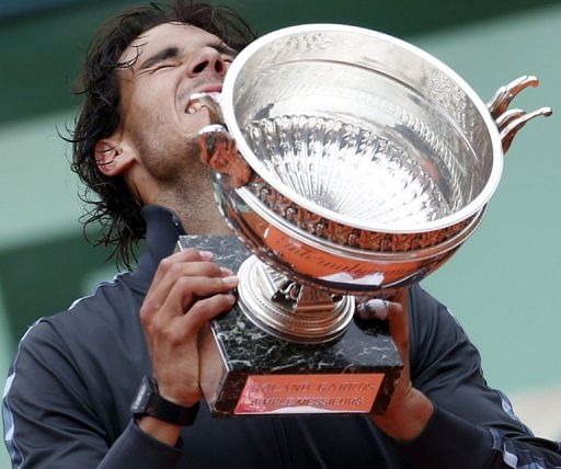 An emotional Nadal clutches his seventh French Open trophy An emotional Nadal clutches his seventh French Open trophy
