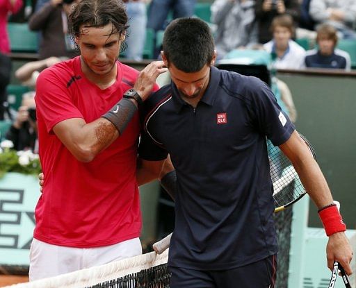 Nadal consoles Djokovic after the match Nadal consoles Djokovic after the match