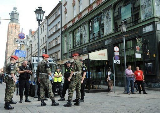 Polish policemen and military police forces outside the fan zone in Wroclaw on June 8 Polish policemen and military police forces outside the fan zone in Wroclaw on June 8