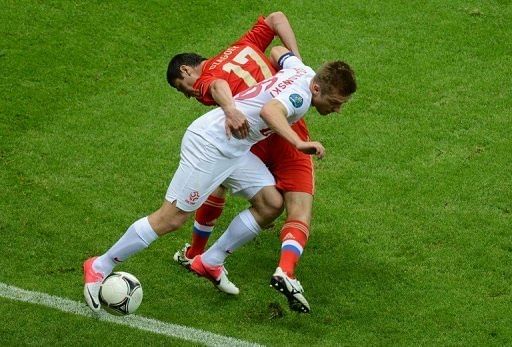 Poland's Jakub Blaszczykowski (in white) and Russia's Alan Dzagoev both scored to ensure a 1-1 draw Poland's Jakub Blaszczykowski (in white) and Russia's Alan Dzagoev both scored to ensure a 1-1 draw