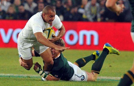 England's Jonathan Joseph (L) is tackled by a South African player England's Jonathan Joseph (L) is tackled by a South African player