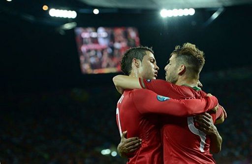 Portuguese forward Cristiano Ronaldo (R) celebrates with Portuguese midfielder Miguel Veloso after scoring Portuguese forward Cristiano Ronaldo (R) celebrates with Portuguese midfielder Miguel Veloso after scoring