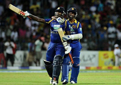 Sri Lankan cricketer Angelo Mathews (L) and Nuwan Kulasekara (R) celebrate after victory Sri Lankan cricketer Angelo Mathews (L) and Nuwan Kulasekara (R) celebrate after victory