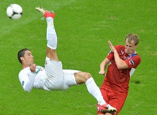 Portuguese forward Cristiano Ronaldo (L) tries to score despite Czech defender David Limbersky Portuguese forward Cristiano Ronaldo (L) tries to score despite Czech defender David Limbersky