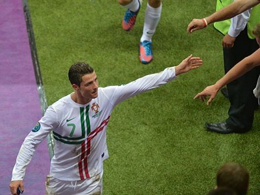 Cristiano Ronaldo cheers with fans as he leaves the pitch Cristiano Ronaldo cheers with fans as he leaves the pitch