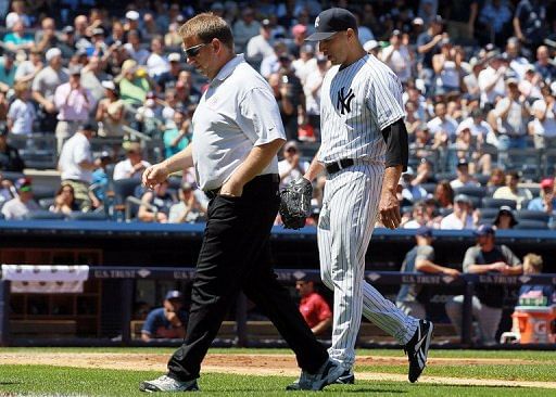 Andy Pettitte of the New York Yankees follows assistant trainer Mark Littlefield to the locker room Andy Pettitte of the New York Yankees follows assistant trainer Mark Littlefield to the locker room