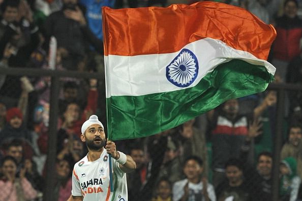 Sandeep Singh of India waves the Indian