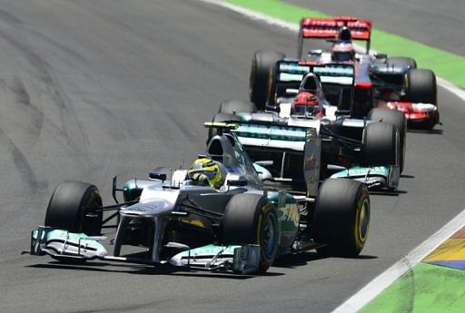 Mercedes' German drivers Nico Rosberg andMichael Schumacher and McLaren Mercedes' British driver Lewis Hamilton on track Mercedes' German drivers Nico Rosberg andMichael Schumacher and McLaren Mercedes' British driver Lewis Hamilton on track