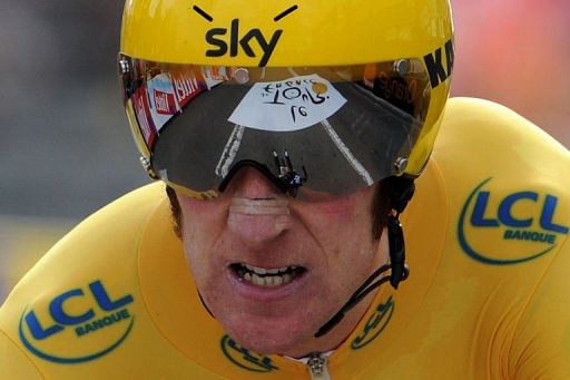 British Bradley Wiggins reacts at the end of the individual time-trial British Bradley Wiggins reacts at the end of the individual time-trial