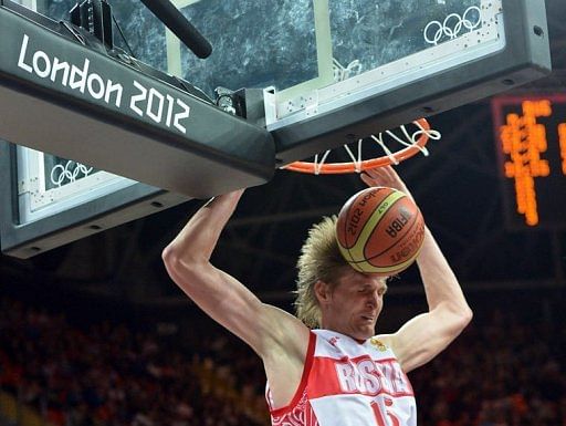 Russian forward Andrey Kirilenko scores Russian forward Andrey Kirilenko scores