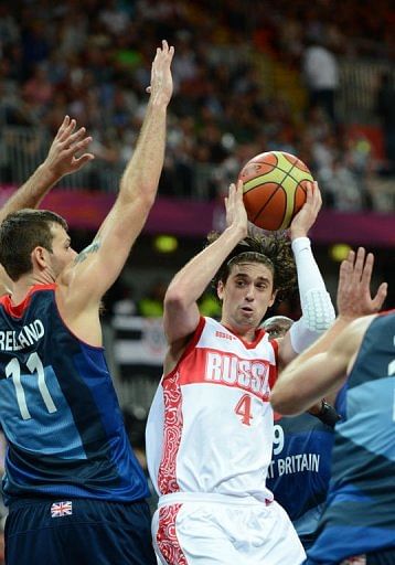 Russian guard Alexey Shved (R) is to shoot in front of British forward Joel Freeland Russian guard Alexey Shved (R) is to shoot in front of British forward Joel Freeland