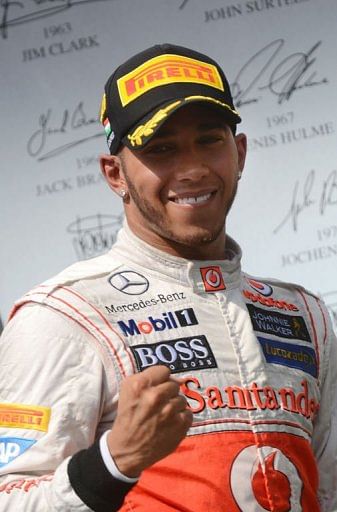 Lewis Hamilton celebrates on the podium Lewis Hamilton celebrates on the podium