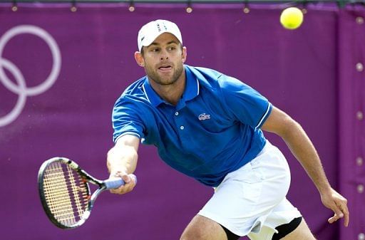 Andy Roddick returns the ball to Martin Klizan during the first round Monday Andy Roddick returns the ball to Martin Klizan during the first round Monday