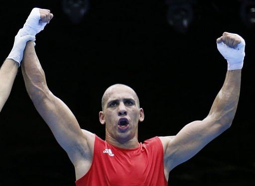 Ihab Almatbouli of Jordan celebrates his 19-7 points decision over Lukmon Lawal of Nigeria Ihab Almatbouli of Jordan celebrates his 19-7 points decision over Lukmon Lawal of Nigeria