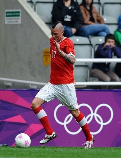 Switzerland's Michel Morganella, pictured July 26, was sent home for racist tweets Switzerland's Michel Morganella, pictured July 26, was sent home for racist tweets