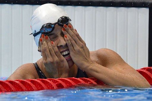 Netherlands' Ranomi Kromowidjojo celebrates her gold medal Netherlands' Ranomi Kromowidjojo celebrates her gold medal