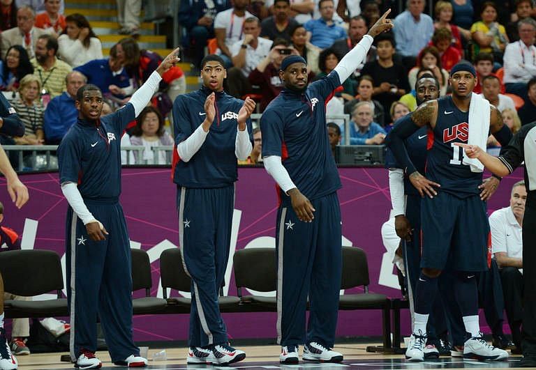 US players react during the men's basketball preliminary round match Argentina vs USA