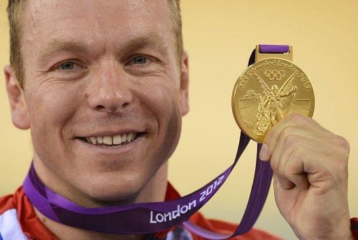 Great Britain's Chris Hoy poses on the podium after winning the gold medal Great Britain's Chris Hoy poses on the podium after winning the gold medal