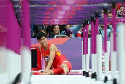 China's Liu Xiang reacts after falling while competing in the men's 110m hurdles heats China's Liu Xiang reacts after falling while competing in the men's 110m hurdles heats
