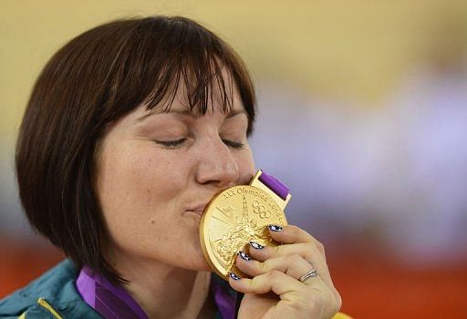 Australia's Anna Meares celebrates on the podium after winning the gold medal Australia's Anna Meares celebrates on the podium after winning the gold medal