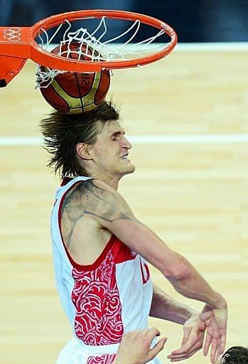 Russian forward Andrey Kirilenko scores against Lithuania