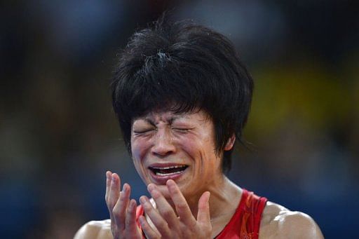 Japan&#39;s Hitomi Obara reacts after defeating Azerbaijan&#39;s Mariya Stadnyk in their women&#39;s 48kg freestyle match to win gold during the wrestling event of the ... - photo_1344450208818-2-0