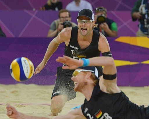 Germany's right blocker Jonas Reckermann (foreground) dives to reach the ball as teammate Julius Brink looks on Germany's right blocker Jonas Reckermann (foreground) dives to reach the ball as teammate Julius Brink looks on