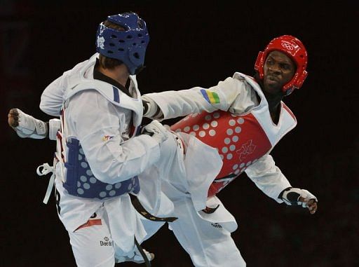 Turkey's Bahri Tanrikulu (blue) fights against Gabon's Anthony Obame Turkey's Bahri Tanrikulu (blue) fights against Gabon's Anthony Obame