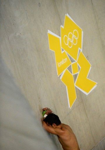 China's Qiu Bo reacts to his silver medal on Saturday China's Qiu Bo reacts to his silver medal on Saturday