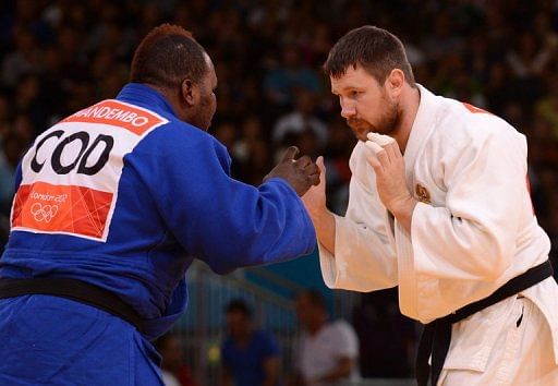 Russia's Alexander Mikhaylin (white) competes with DR Congo's Cedric Mandembo Kebika (blue) on August 3 Russia's Alexander Mikhaylin (white) competes with DR Congo's Cedric Mandembo Kebika (blue) on August 3