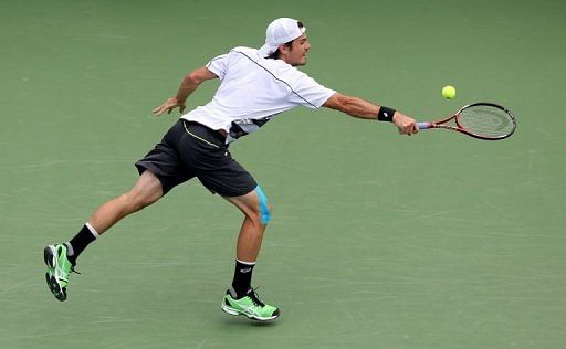 Tommy Haas of Germany hits a backhand against David Nalbandian of Argentina Tommy Haas of Germany hits a backhand against David Nalbandian of Argentina