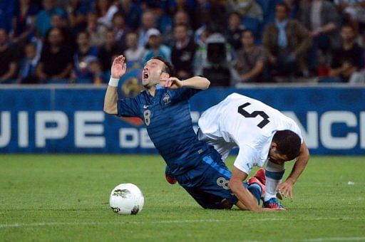 French midfielder Mathieu Valbuena (L) collides with Uruguayan midfielder Walter Gargano French midfielder Mathieu Valbuena (L) collides with Uruguayan midfielder Walter Gargano