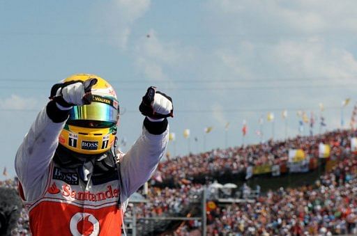 McLaren Mercedes' British driver Lewis Hamilton celebrates celebrates a win in July McLaren Mercedes' British driver Lewis Hamilton celebrates celebrates a win in July
