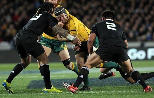 Australia's Benn Robinson is tackled by New Zealand's Ma'a Nano (left) and Keven Mealamu Australia's Benn Robinson is tackled by New Zealand's Ma'a Nano (left) and Keven Mealamu
