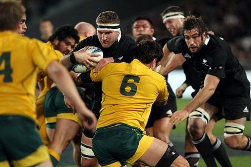 New Zealand All Blacks Kieran Reid (left) is tackled by Dave Dennis (right) of Australia New Zealand All Blacks Kieran Reid (left) is tackled by Dave Dennis (right) of Australia