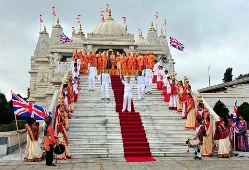 Torchbearers pose with the Paralympic flame outside the Shri Swaminarayan Mandir Temple in London Torchbearers pose with the Paralympic flame outside the Shri Swaminarayan Mandir Temple in London
