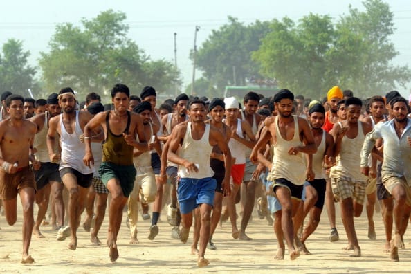 Candidates run during a physical fitness