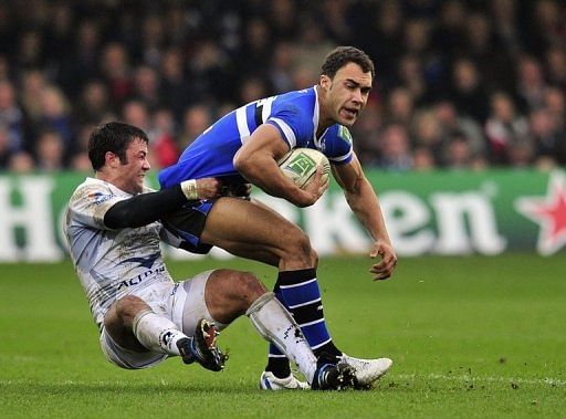 Bath's winger Olly Woodburn (right) is tackled by Montpellier Herault centre Paul Bosch Bath's winger Olly Woodburn (right) is tackled by Montpellier Herault centre Paul Bosch